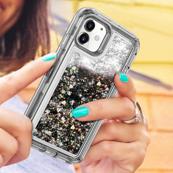 Woman holding black iPhone bling case outdoor